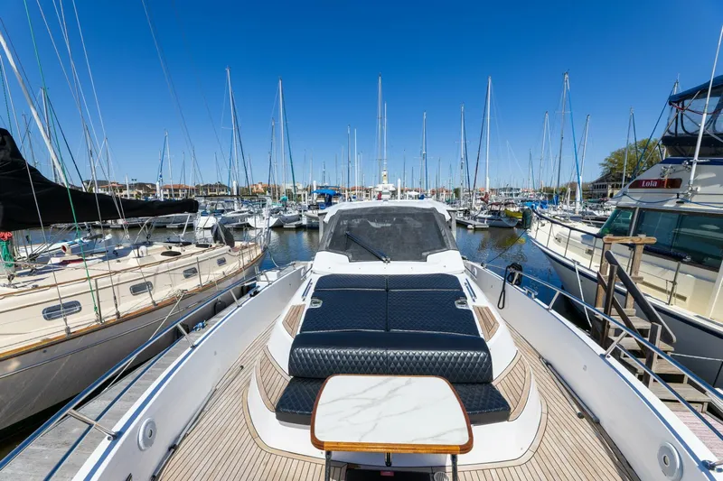 Loki Yacht Photos Pics Azimut Verve 40 yacht, 2018 model, docked in a marina with clear blue skies.