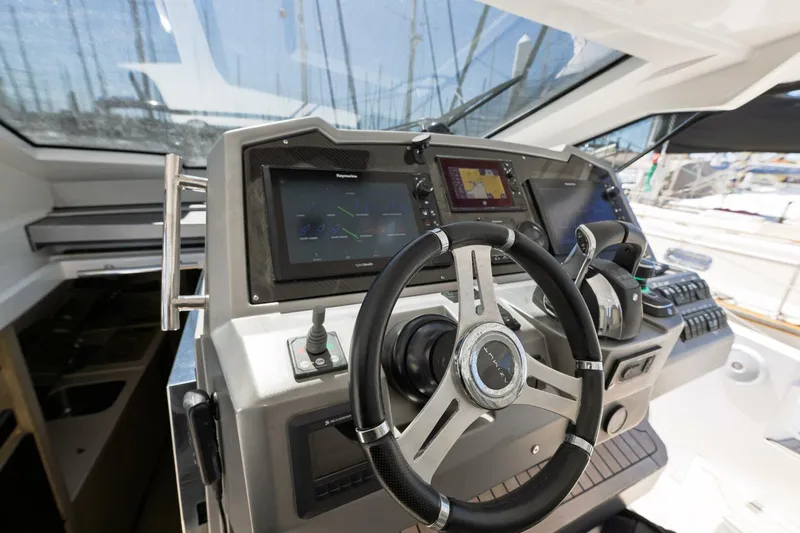 Loki Yacht Photos Pics Helm of 2018 Azimut Verve 40 yacht with advanced navigation systems and steering wheel.
