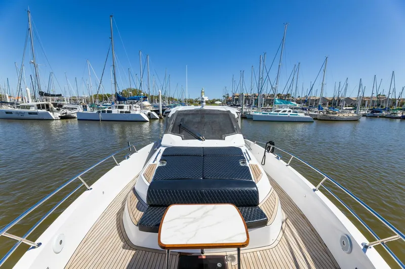 Loki Yacht Photos Pics Azimut Verve 40 yacht, 2018 model, docked in a marina with sailboats.