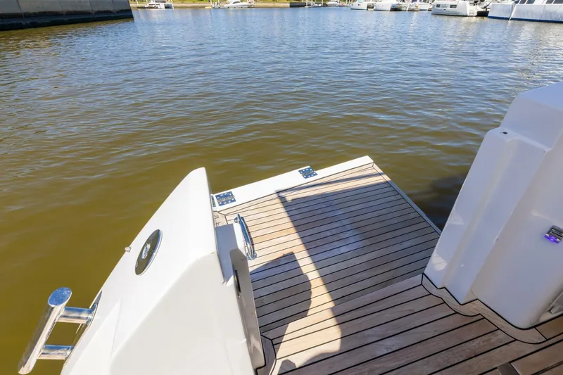 Loki Yacht Photos Pics 2018 Azimut Verve 40 yacht with teak deck by the water.