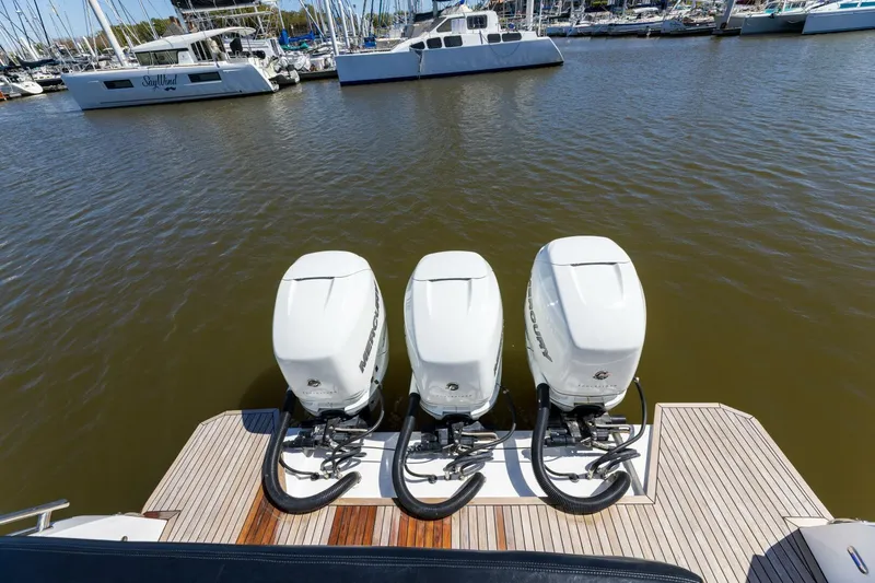 Loki Yacht Photos Pics Three powerful outboard engines on a 2018 Azimut Verve 40 yacht, docked in a marina.