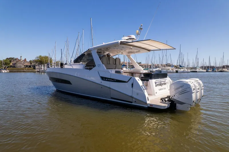Loki Yacht Photos Pics 2018 Azimut Verve 40 yacht on calm water, marina background.