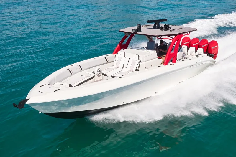  Yacht Photos Pics 2025 Midnight Express 37' Open boat cruising on clear blue water.