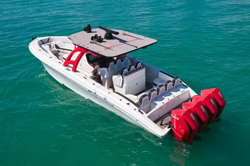  Yacht Photos Pics 2025 Midnight Express 37' Open boat with red engines on clear blue water.