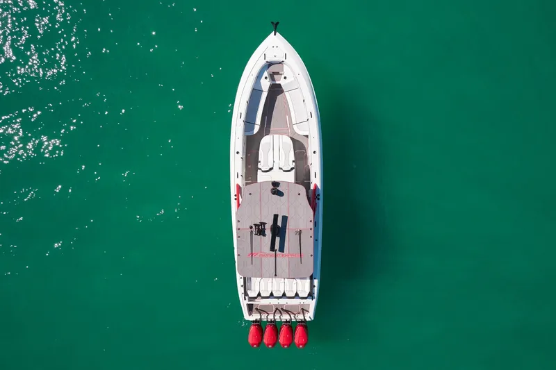  Yacht Photos Pics Aerial view of 2025 Midnight Express 37' Open boat on turquoise water.