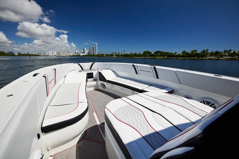  Yacht Photos Pics 2025 Midnight Express 37' Open boat with luxurious seating on a sunny day.