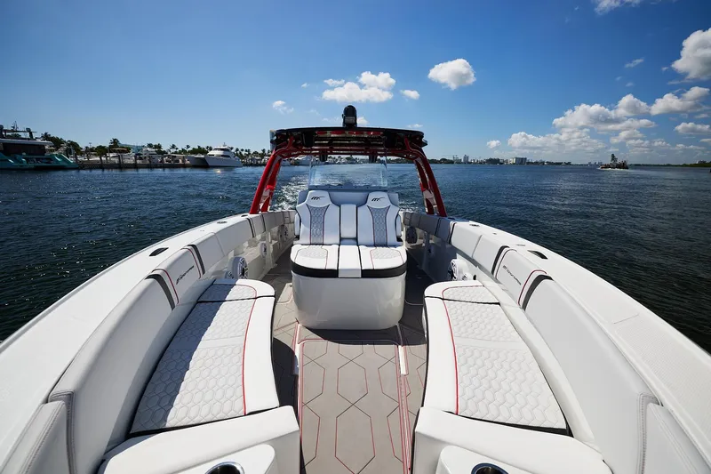  Yacht Photos Pics 2025 Midnight Express 37' Open boat interior with luxurious seating on a sunny day.