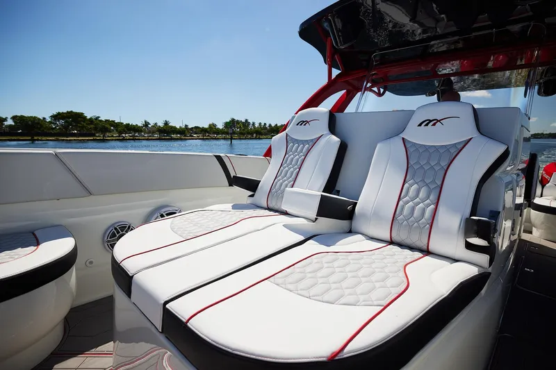  Yacht Photos Pics Luxurious seating on 2025 Midnight Express 37' Open boat, featuring sleek design and waterfront view.