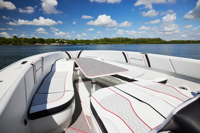  Yacht Photos Pics Luxurious 2025 Midnight Express 37' Open boat interior with sleek seating and table.