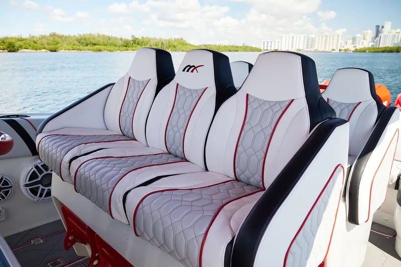  Yacht Photos Pics Luxurious seating on 2025 Midnight Express 37' Open boat, featuring stylish design and waterfront view.