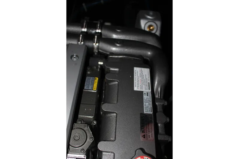 Spellbound Yacht Photos Pics Engine compartment of 2022 Beneteau Oceanis Yacht 54, showcasing mechanical components.