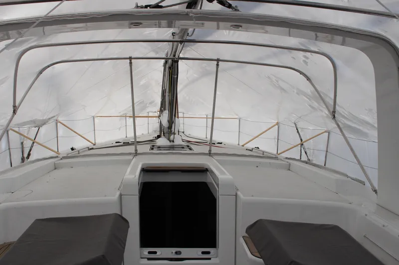 Spellbound Yacht Photos Pics Beneteau Oceanis Yacht 54, 2022 model, covered deck view with protective canopy.
