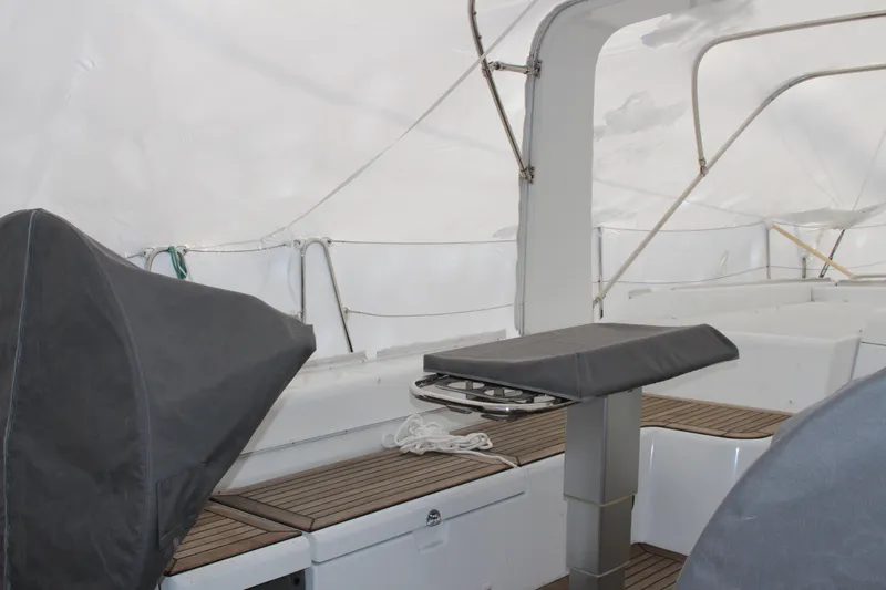 Spellbound Yacht Photos Pics From stbd aft helm, looking forward and to port. Teak tables, with covers, telescoping and folding, with handrails for bad weather.