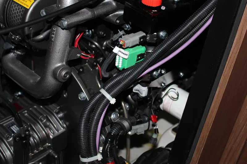 Spellbound Yacht Photos Pics CLEAN!!!! Engine compartment of 2022 Beneteau Oceanis Yacht 54, showcasing wiring and components.