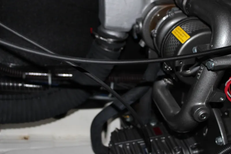 Spellbound Yacht Photos Pics Engine compartment of 2022 Beneteau Oceanis Yacht 54, showcasing mechanical components and wiring.