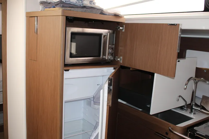 Spellbound Yacht Photos Pics Port-aft galley. Microwave above the fridge