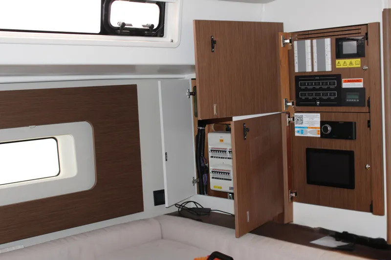 Spellbound Yacht Photos Pics Stbd saloon, looking aft. This bulkhead has easy access to electronics. Retractable TV below.