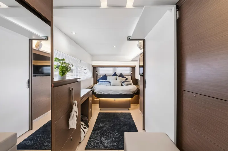 Closer To The Sun Yacht Photos Pics Luxurious interior of 2025 Leopard 53 Powercat with modern bedroom design and elegant decor.