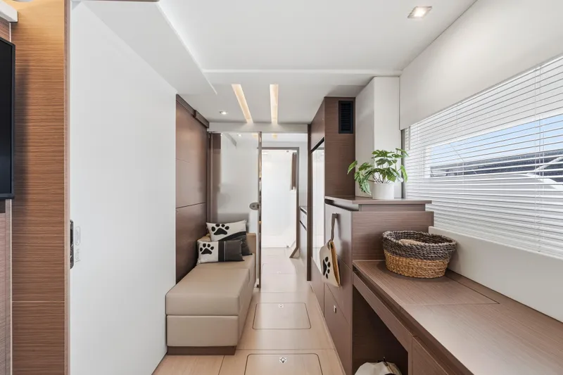 Closer To The Sun Yacht Photos Pics Luxurious interior of 2025 Leopard 53 Powercat yacht with modern design and elegant furnishings.