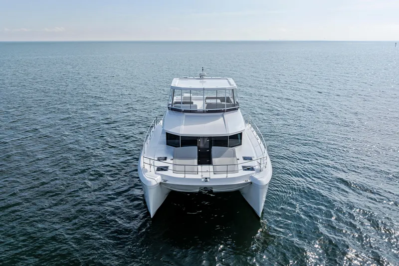 Closer To The Sun Yacht Photos Pics 2025 Leopard 53 Powercat yacht on open water, front view.