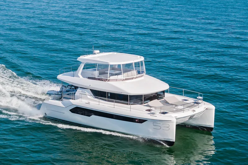 Closer To The Sun Yacht Photos Pics 2025 Leopard 53 Powercat cruising on open water, showcasing sleek design and modern features.