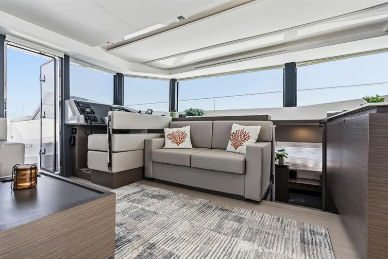 Closer To The Sun Yacht Photos Pics Luxurious interior of 2025 Leopard 53 Powercat yacht with modern seating and decor.