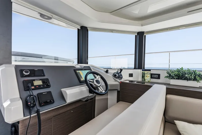 Closer To The Sun Yacht Photos Pics Modern helm station of 2025 Leopard 53 Powercat with sleek design and advanced controls.