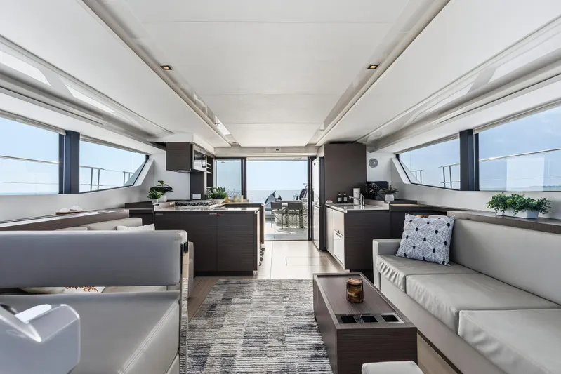 Closer To The Sun Yacht Photos Pics Luxurious interior of 2025 Leopard 53 Powercat yacht with modern furnishings and panoramic windows.
