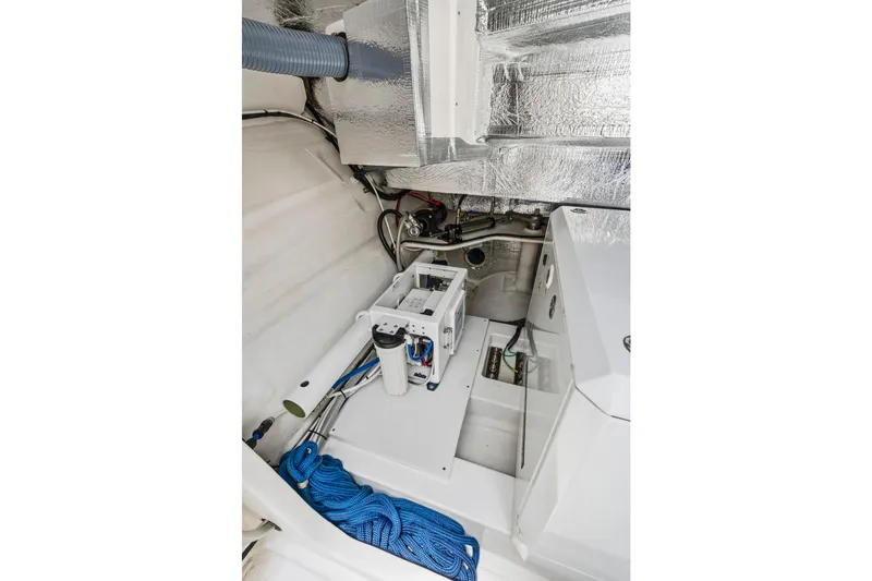 Closer To The Sun Yacht Photos Pics Engine room of 2025 Leopard 53 Powercat with equipment and blue rope.