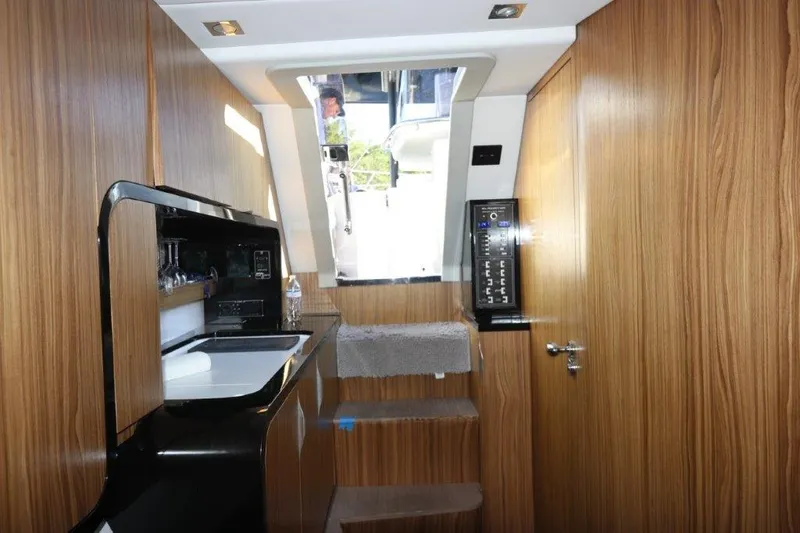  Yacht Photos Pics Interior of 2018 Canados Gladiator 428 yacht with wooden cabinetry and modern amenities.