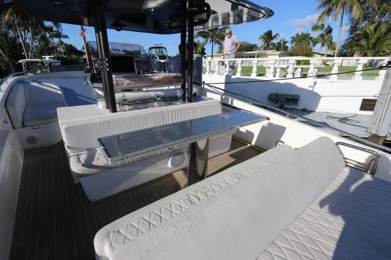  Yacht Photos Pics 2018 Canados Gladiator 428 yacht interior with white seating and dining area.