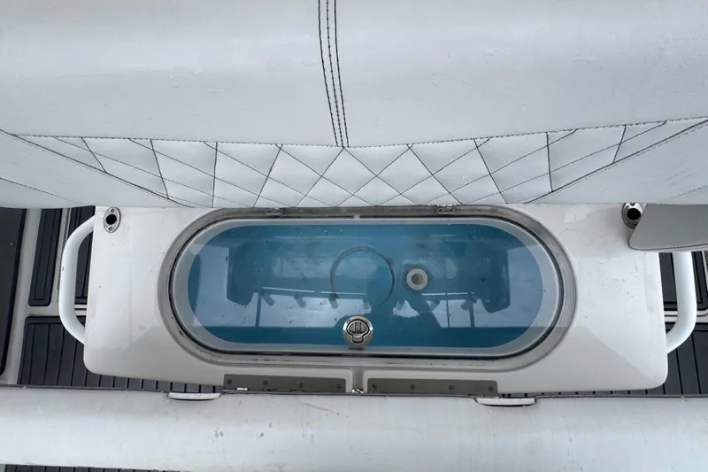  Yacht Photos Pics 2018 Fountain 34 Center Console livewell with cushioned seating and sleek design.