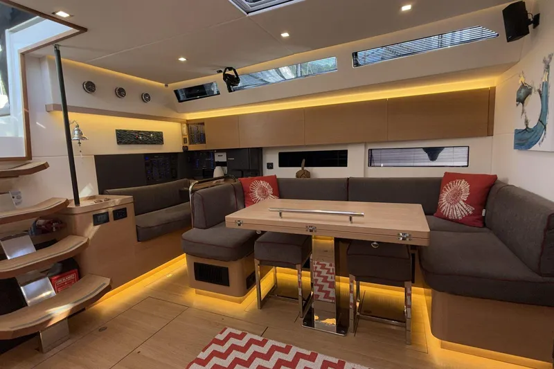  Yacht Photos Pics Luxurious interior of 2019 Amel 50 yacht with modern seating and ambient lighting.