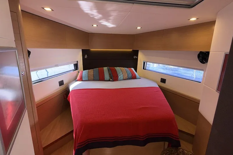  Yacht Photos Pics Luxurious cabin interior of 2019 Amel 50 yacht with cozy bed and modern design.