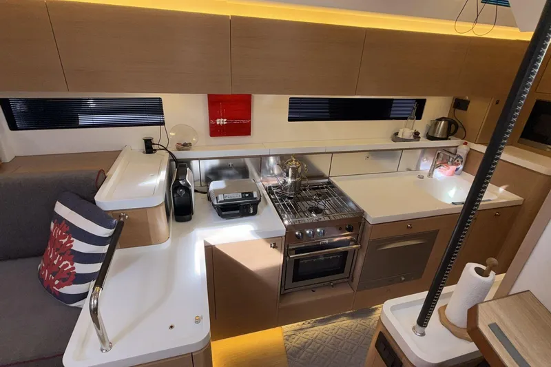  Yacht Photos Pics Modern kitchen interior of 2019 Amel 50 yacht with sleek appliances and stylish design.