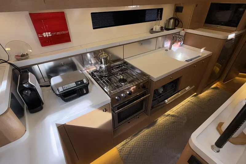  Yacht Photos Pics Modern kitchen in a 2019 Amel 50 yacht with appliances and sleek design.