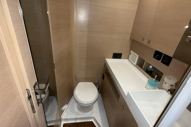  Yacht Photos Pics Modern bathroom interior on 2019 Amel 50 yacht, featuring sleek design and compact layout.