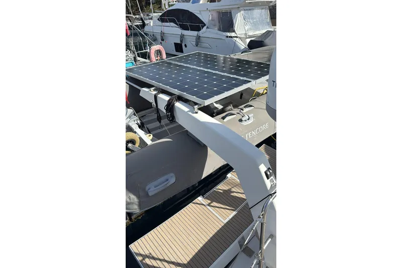  Yacht Photos Pics 2019 Amel 50 yacht with solar panels and inflatable boat on deck.