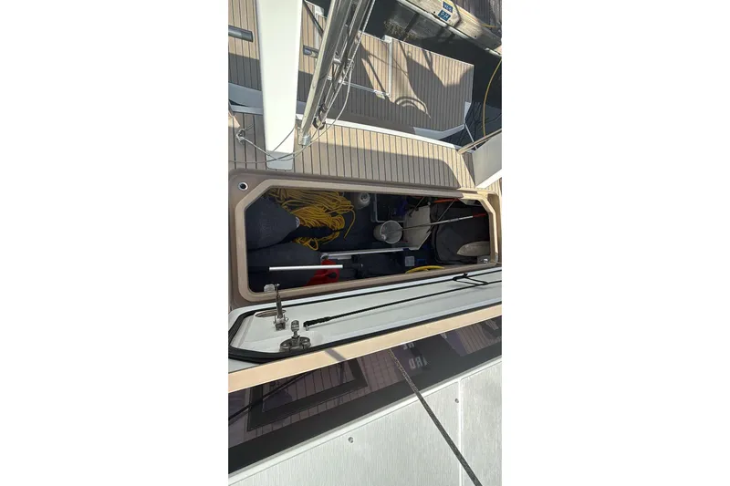  Yacht Photos Pics Storage compartment on 2019 Amel 50 yacht, featuring ropes and equipment.