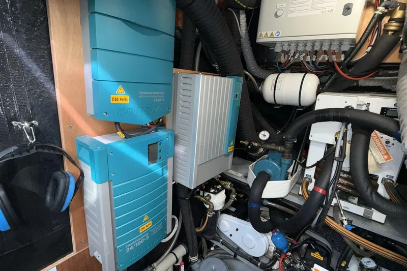  Yacht Photos Pics Engine room of a 2019 Amel 50 yacht with electrical systems and equipment.