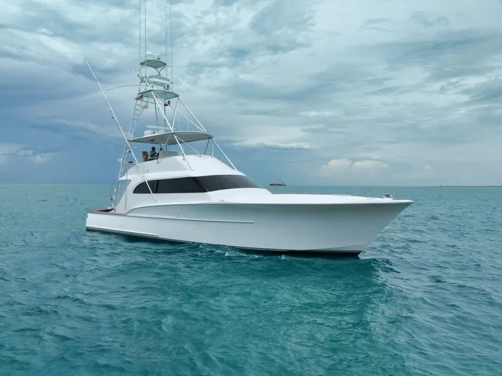 Let It Ride Yacht Photos Pics 2008 Sculley Custom Carolina yacht on calm turquoise waters under cloudy sky.