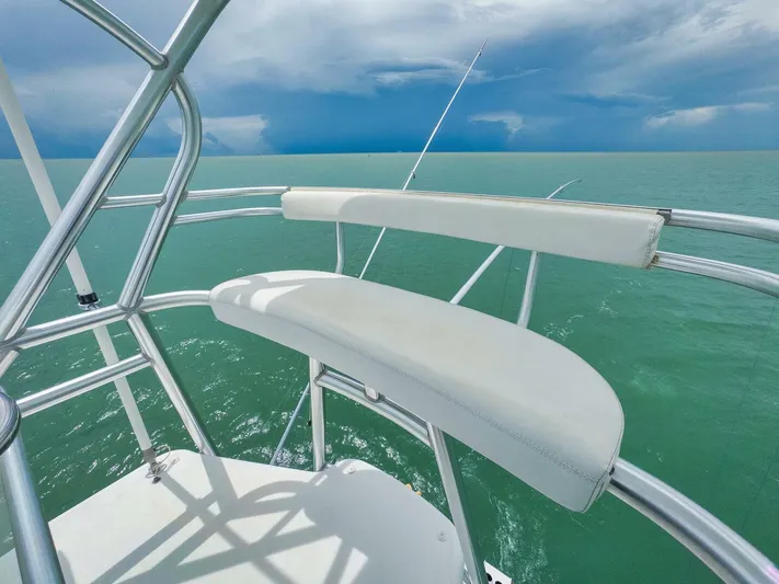 Let It Ride Yacht Photos Pics Tower view from 2008 Sculley Custom Carolina boat over turquoise sea and cloudy sky.
