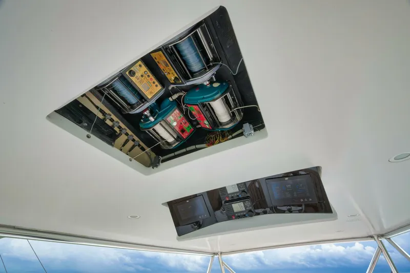 Let It Ride Yacht Photos Pics 2008 Sculley Custom Carolina boat electronics and wiring panel on ceiling, showcasing advanced marine technology.