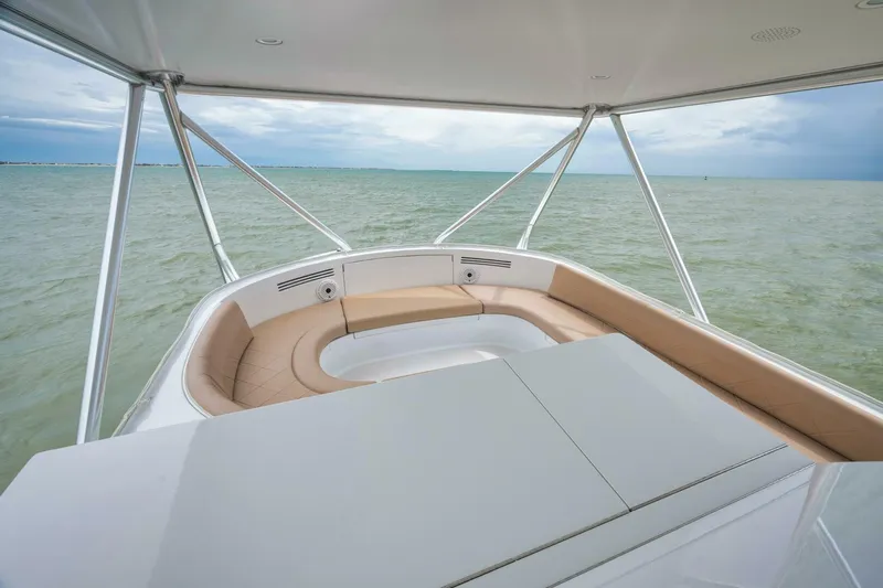 Let It Ride Yacht Photos Pics 2008 Sculley Custom Carolina boat with spacious seating, overlooking calm ocean waters.