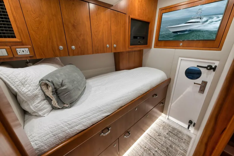Let It Ride Yacht Photos Pics Luxurious 2008 Sculley Custom Carolina yacht cabin with wooden cabinetry and cozy bedding.