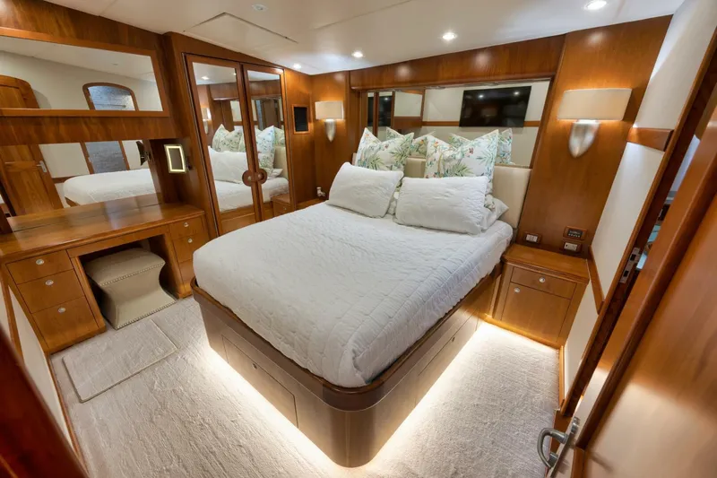 Let It Ride Yacht Photos Pics Luxurious bedroom interior of 2008 Sculley Custom Carolina yacht with elegant wood finishes.