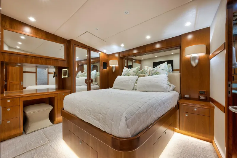 Let It Ride Yacht Photos Pics Luxurious bedroom interior of 2008 Sculley Custom Carolina yacht with elegant wood finishes.