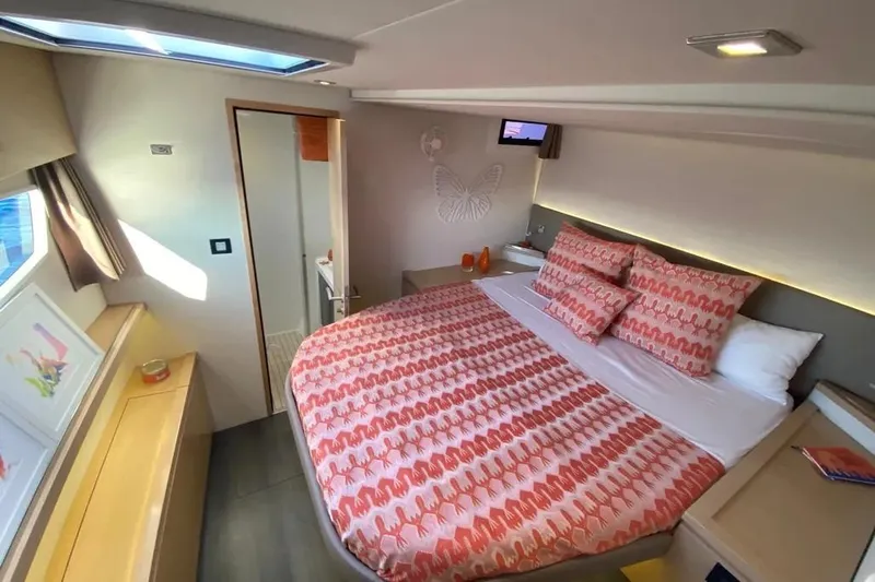 Xclip Yacht Photos Pics Luxurious cabin interior of 2015 Fountaine Pajot SABA 50 catamaran with vibrant bedding.