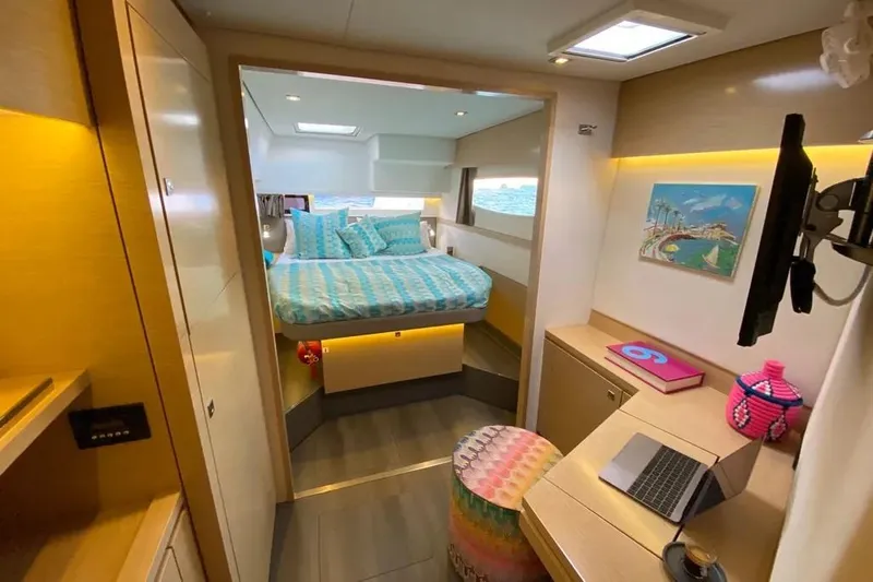 Xclip Yacht Photos Pics Luxurious 2015 Fountaine Pajot SABA 50 yacht cabin with modern decor and cozy bedding.