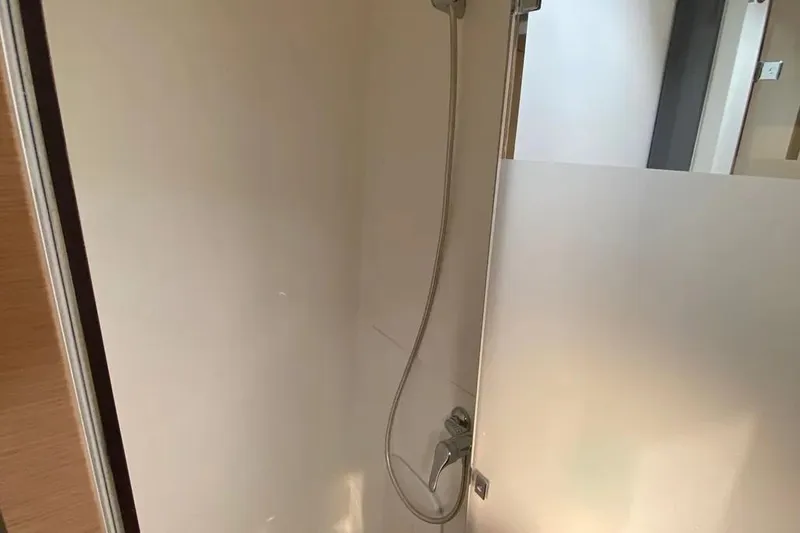 Xclip Yacht Photos Pics Shower area in 2015 Fountaine Pajot SABA 50 catamaran, featuring modern fixtures.